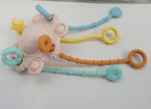 Image 1: Product in pink with four strings in various colors.